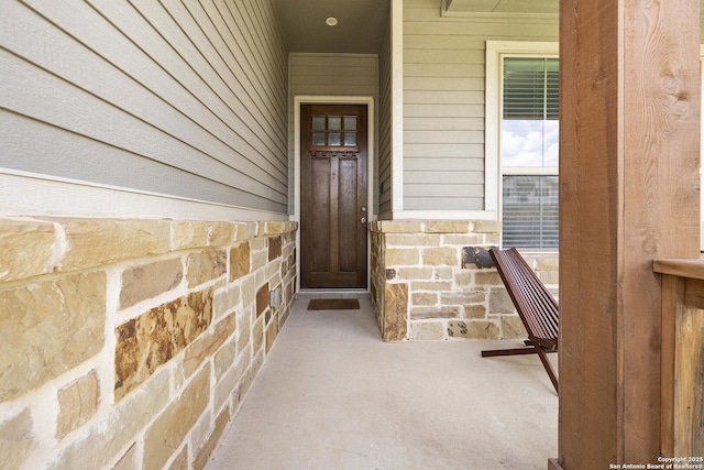 11631 Troubadour, San Antonio, TX 78245 - view of exterior entry with stone siding and a porch