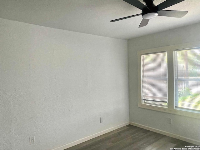 3022 El Paso, San Antonio, TX 78207 - empty room featuring dark wood-type flooring and a ceiling fan