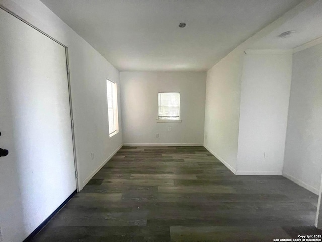 3022 El Paso, San Antonio, TX 78207 - unfurnished room featuring wood finished floors and baseboards