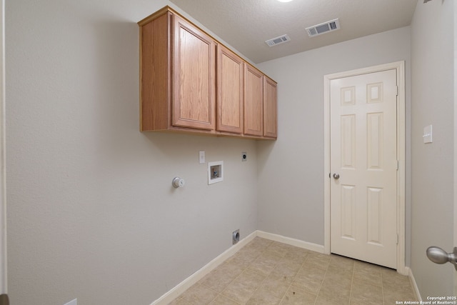 173 Great Oaks Ln, Vernia, TX 78121 - laundry room with hookup for an electric dryer, hookup for a gas dryer, washer hookup, and cabinet space
