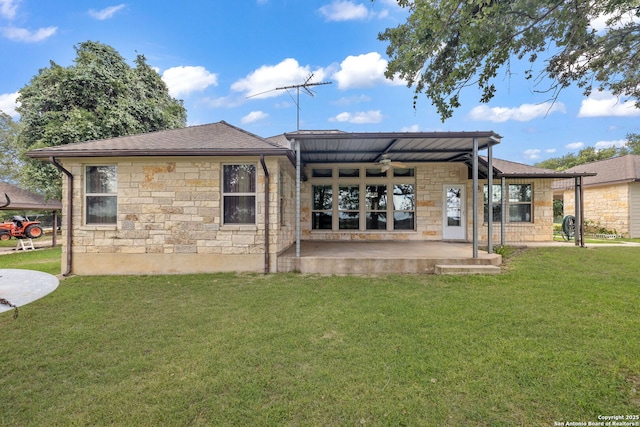 173 Great Oaks Ln, Vernia, TX 78121 - rear view of property with stone siding, a patio area, a lawn, and roof with shingles