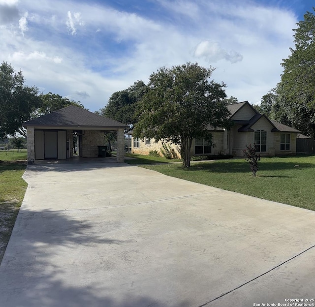 173 Great Oaks Ln, Vernia, TX 78121 - view of side of property with driveway, a lawn, and stone siding