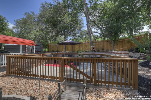 332 W Klein, Seguin, TX 78155 - wooden terrace featuring a fenced backyard and a storage shed