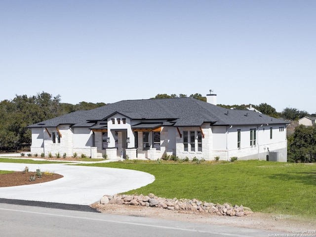 555 Mystic Pkwy, Spring Branch, TX 78070 - view of front facade featuring stone siding, curved driveway, a front lawn, and stucco siding