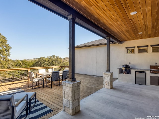 555 Mystic Pkwy, Spring Branch, TX 78070 - deck featuring outdoor dining space and an outdoor kitchen