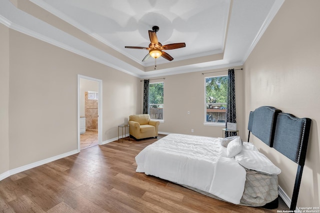 11546 Creek Bow, San Antonio, TX 78253 - bedroom with a raised ceiling, wood finished floors, ornamental molding, ensuite bathroom, and ceiling fan