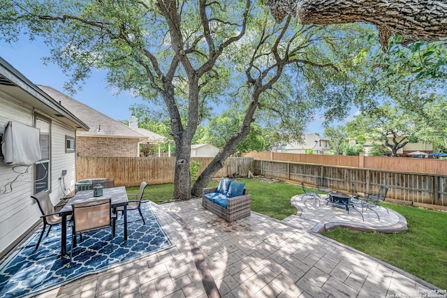 11546 Creek Bow, San Antonio, TX 78253 - fenced backyard with an outdoor fire pit, outdoor dining space, and a patio