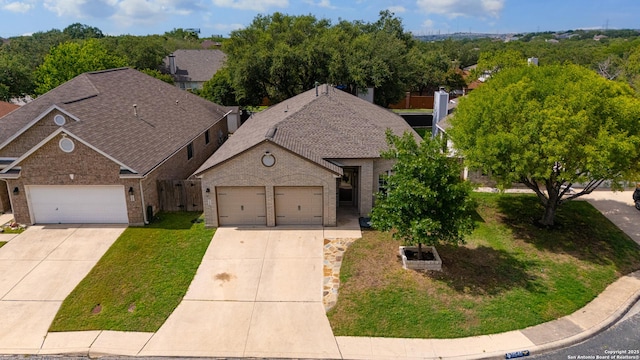 11546 Creek Bow, San Antonio, TX 78253 - view of front facade featuring brick siding, driveway, an attached garage, a shingled roof, and a front yard