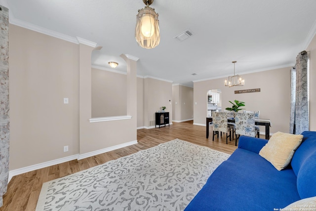 11546 Creek Bow, San Antonio, TX 78253 - living room featuring wood finished floors, a chandelier, and crown molding