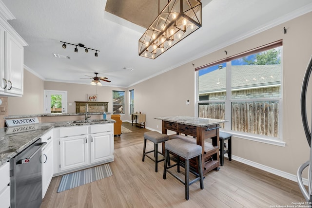 11546 Creek Bow, San Antonio, TX 78253 - kitchen with dishwasher, a ceiling fan, light wood-style floors, white cabinetry, and crown molding