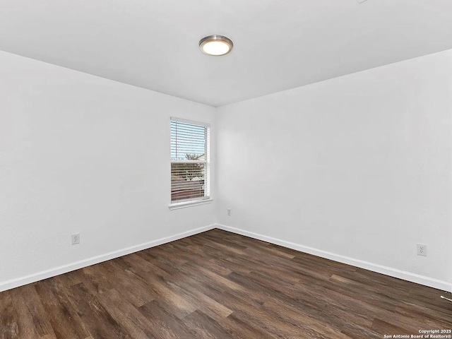 221 Peppergrass Cv, Kyle, TX 78640 - empty room featuring dark wood finished floors and baseboards