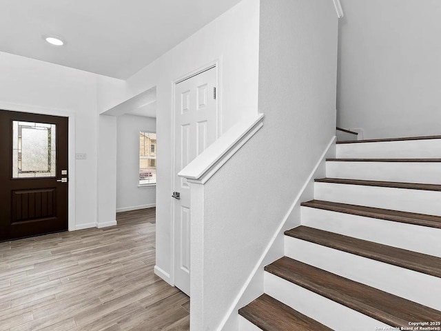 221 Peppergrass Cv, Kyle, TX 78640 - foyer entrance with stairway, light wood finished floors, and recessed lighting