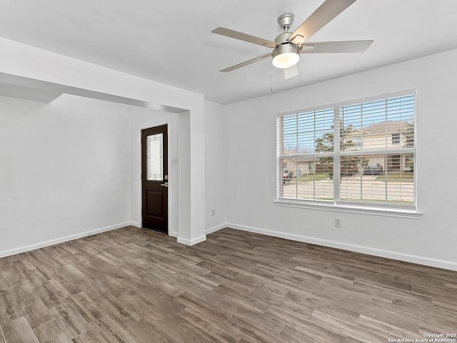 221 Peppergrass Cv, Kyle, TX 78640 - unfurnished room featuring wood finished floors, healthy amount of natural light, and ceiling fan