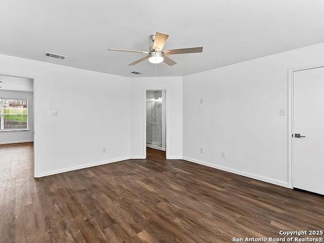 221 Peppergrass Cv, Kyle, TX 78640 - empty room featuring a ceiling fan and wood finished floors