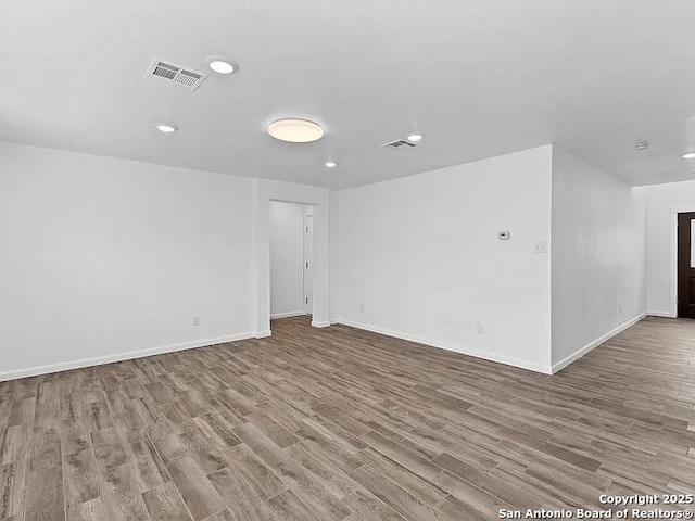 221 Peppergrass Cv, Kyle, TX 78640 - spare room featuring wood finished floors and recessed lighting