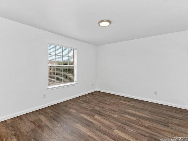 221 Peppergrass Cv, Kyle, TX 78640 - empty room with wood finished floors and baseboards
