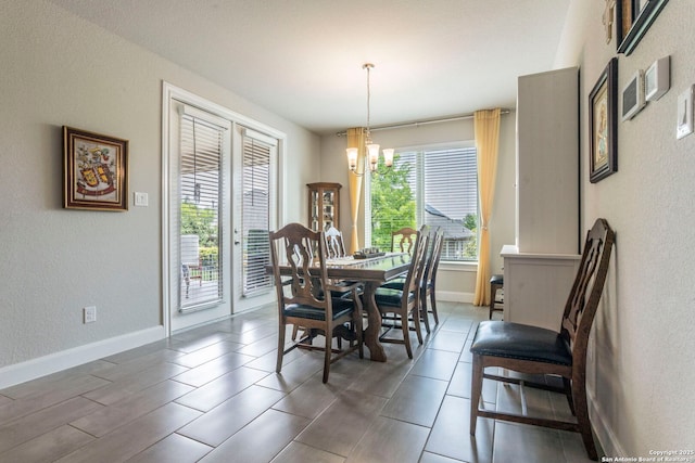 13822 Greater Straw, San Antonio, TX 78254 - dining area featuring a chandelier and a textured wall