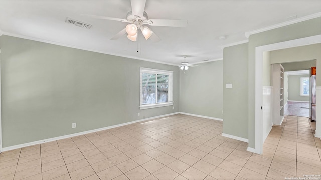 1261 Mill, New Braunfels, TX 78130 - spare room with plenty of natural light, light tile patterned floors, ornamental molding, and a ceiling fan