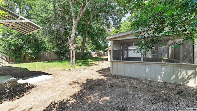 1261 Mill, New Braunfels, TX 78130 - fenced backyard featuring a sunroom