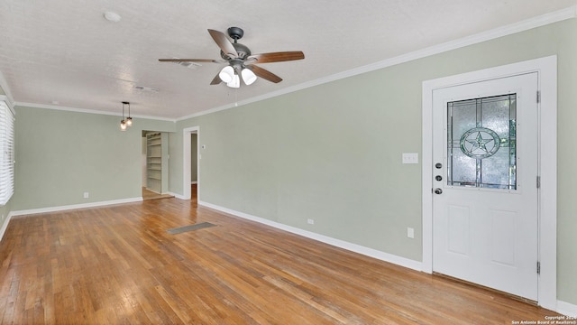 1261 Mill, New Braunfels, TX 78130 - entryway featuring light wood-style floors, a ceiling fan, and crown molding