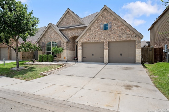 2129 Rustling Way, Seguin, TX 78155 - view of front facade with brick siding, driveway, and a shingled roof