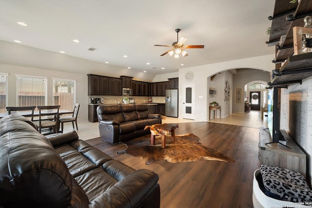 2129 Rustling Way, Seguin, TX 78155 - living room featuring arched walkways, ceiling fan, light wood-style floors, plenty of natural light, and recessed lighting