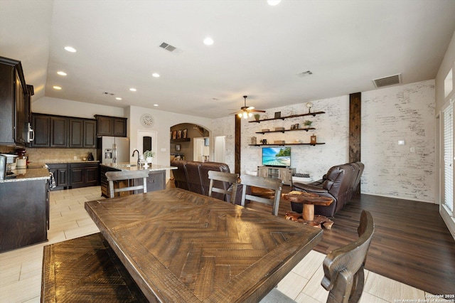 2129 Rustling Way, Seguin, TX 78155 - dining space featuring a ceiling fan, arched walkways, and recessed lighting