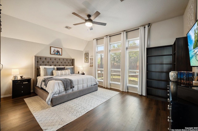 2129 Rustling Way, Seguin, TX 78155 - bedroom featuring lofted ceiling, dark wood finished floors, ceiling fan, and access to outside
