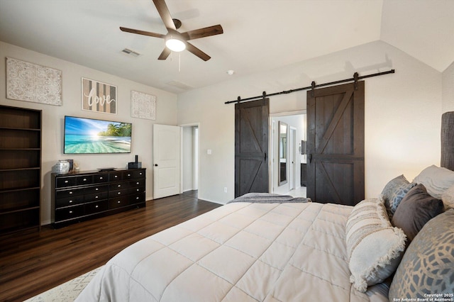2129 Rustling Way, Seguin, TX 78155 - bedroom featuring a barn door, wood finished floors, and ceiling fan