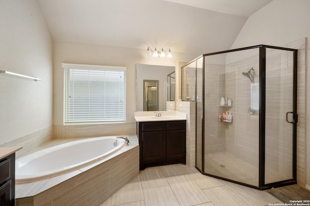 2129 Rustling Way, Seguin, TX 78155 - bathroom featuring vanity, a garden tub, a stall shower, and vaulted ceiling