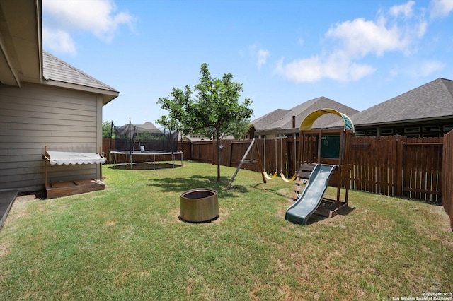 2129 Rustling Way, Seguin, TX 78155 - fenced backyard featuring a trampoline and a playground