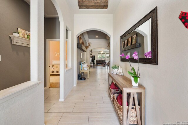 2129 Rustling Way, Seguin, TX 78155 - corridor with arched walkways and light tile patterned flooring