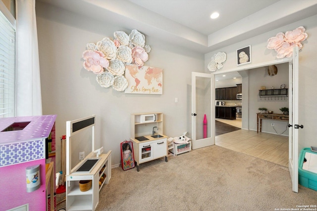 2129 Rustling Way, Seguin, TX 78155 - recreation room featuring light colored carpet, french doors, and recessed lighting