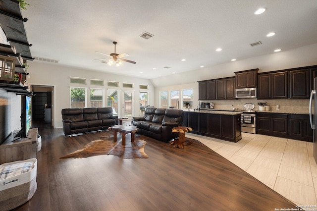 2129 Rustling Way, Seguin, TX 78155 - living room with a ceiling fan, plenty of natural light, recessed lighting, and light wood-style flooring