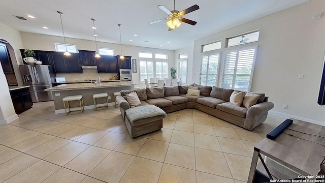 3822 Cordoba Crk, San Antonio, TX 78259 - living room with a ceiling fan, light tile patterned floors, plenty of natural light, and recessed lighting