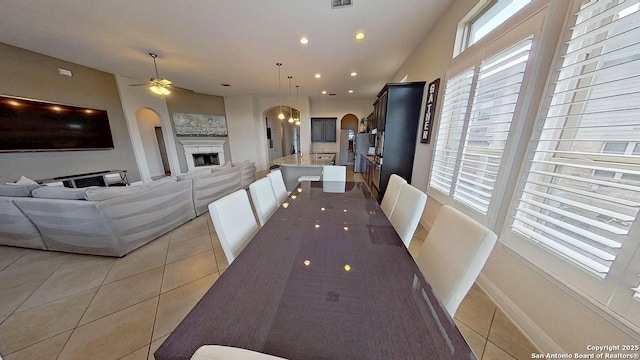 3822 Cordoba Crk, San Antonio, TX 78259 - dining area with arched walkways, light tile patterned floors, plenty of natural light, and recessed lighting