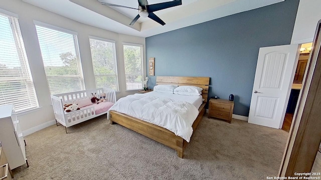 3822 Cordoba Crk, San Antonio, TX 78259 - carpeted bedroom featuring a ceiling fan and a raised ceiling