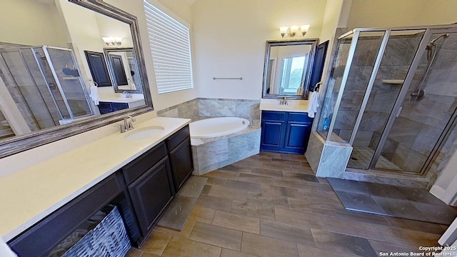 3822 Cordoba Crk, San Antonio, TX 78259 - bathroom featuring a shower stall, two vanities, and a garden tub