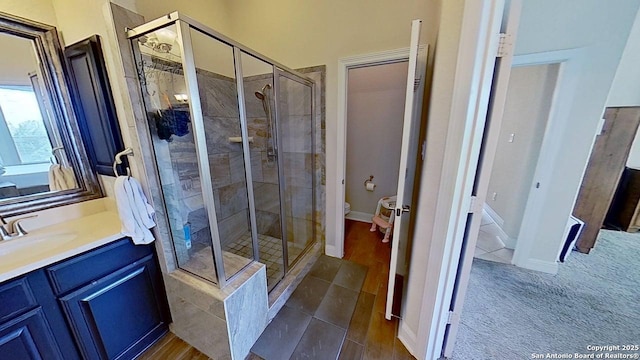 3822 Cordoba Crk, San Antonio, TX 78259 - bathroom featuring a stall shower, vanity, and tile patterned floors