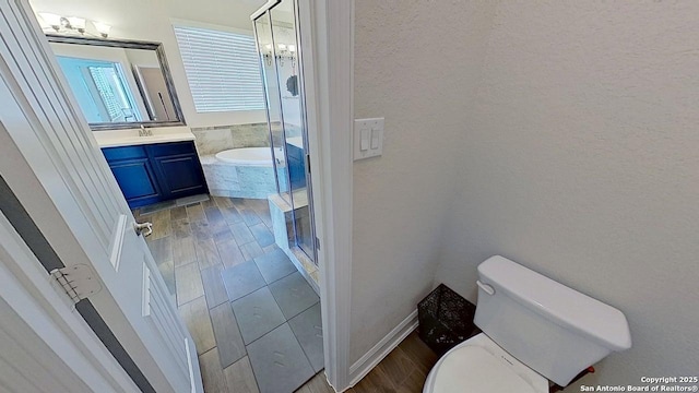 3822 Cordoba Crk, San Antonio, TX 78259 - bathroom featuring vanity, a stall shower, wood finished floors, and a tub to relax in
