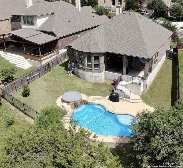 3822 Cordoba Crk, San Antonio, TX 78259 - back of property featuring a fenced backyard, roof with shingles, a patio area, and stone siding