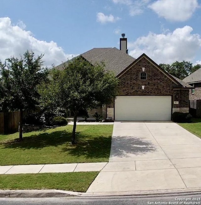 3822 Cordoba Crk, San Antonio, TX 78259 - view of front of house featuring a garage, concrete driveway, a chimney, and a shingled roof