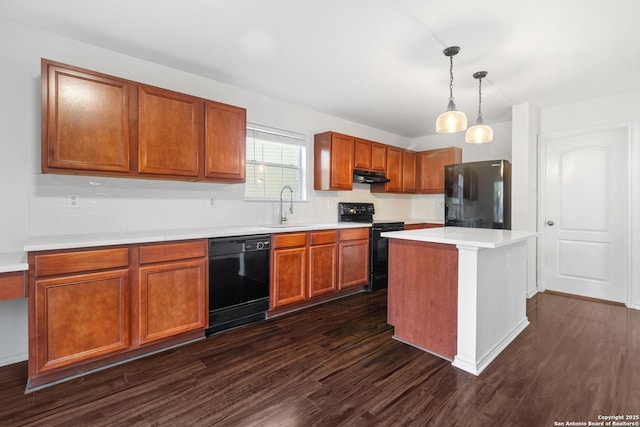 7622 Braes Stage, San Antonio, TX 78254 - kitchen featuring black appliances, dark wood-style flooring, light countertops, and under cabinet range hood