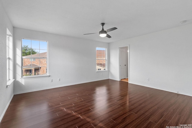 7622 Braes Stage, San Antonio, TX 78254 - spare room featuring a ceiling fan, dark wood-style floors, and plenty of natural light