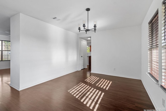 7622 Braes Stage, San Antonio, TX 78254 - unfurnished dining area featuring a chandelier and dark wood-type flooring