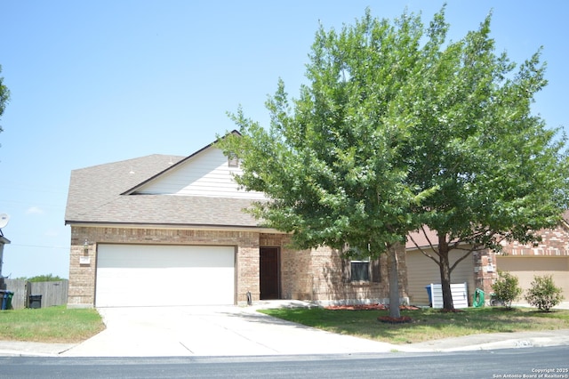 7431 Magnolia Blf, San Antonio, TX 78218 - view of front of house featuring an attached garage, driveway, roof with shingles, and brick siding