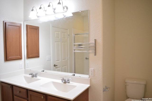 7431 Magnolia Blf, San Antonio, TX 78218 - bathroom with double vanity and a shower with door