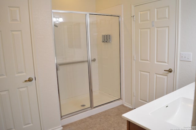 7431 Magnolia Blf, San Antonio, TX 78218 - full bathroom with tile patterned flooring, a stall shower, and vanity
