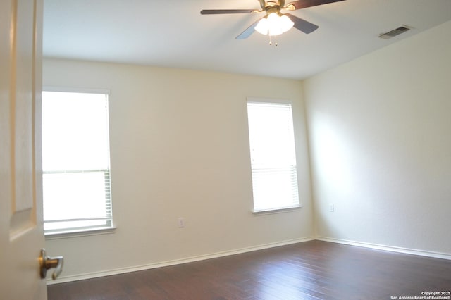 7431 Magnolia Blf, San Antonio, TX 78218 - empty room featuring dark wood-style flooring and ceiling fan