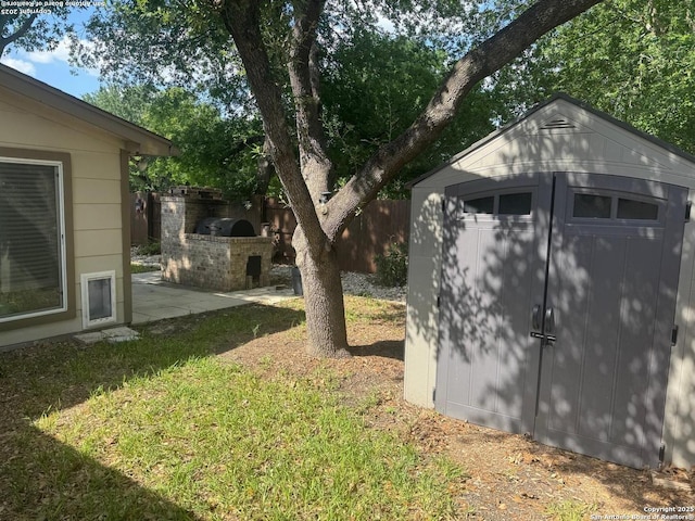 13711 Auburn Oaks, San Antonio, TX 78247 - view of yard with area for grilling, a storage unit, and a patio